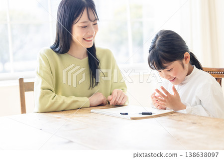 Parents and children studying in the living room Parents and children studying in the living room 138638097