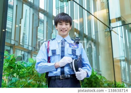 Young Japanese male security guard. Filming assistance provided by: Denpa Gakuen Educational Foundation, Tokyo Electronics College. 138638714