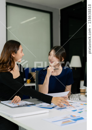 Business consultants discuss tax, merger strategy and restructuring in modern office. 138638818