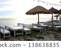 Chairs and tables row on beach with sunset. 138638835