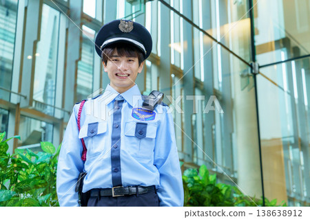 Young Japanese male security guard. Filming assistance provided by: Denpa Gakuen Educational Foundation, Tokyo Electronics College. 138638912