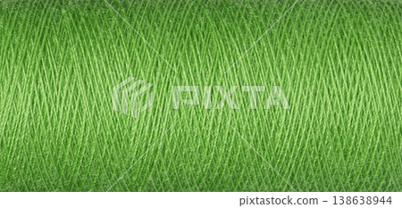 macro texture of a skein of green sewing thread macro texture of a skein of green sewing thread 138638944