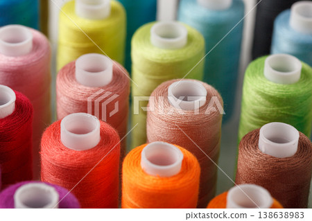 Set of colorful spools of thread 138638983