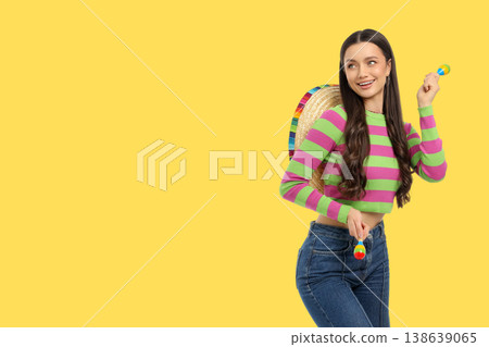 Cinco de Mayo, Young woman smiles in a colorful sombrero outfit Cinco de Mayo, Young woman smiles in a colorful sombrero outfit 138639065