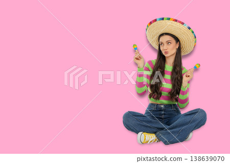 Cinco de Mayo, Woman wears sombrero and holds maracas in festive pose Cinco de Mayo, Woman wears sombrero and holds maracas in festive pose 138639070