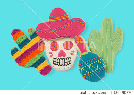 Bright cookies shaped like a skull, cactus, and maraca Bright cookies shaped like a skull, cactus, and maraca 138639079
