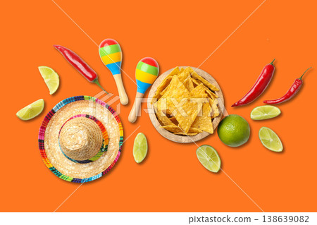 Nachos, lime, maracas, and chilies arranged for Cinco de Mayo Nachos, lime, maracas, and chilies arranged for Cinco de Mayo 138639082