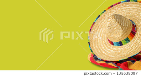 A sombrero rests on colorful fabric for Cinco de Mayo A sombrero rests on colorful fabric for Cinco de Mayo 138639097