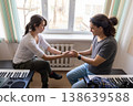 Emotional moment between two students in a music classroom. Friendship and support in college. 138639588