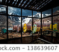 Interior view looking through large windows at the cylindrical huts and snowy peaks of the Zailiyskiy Alatau. 138639607