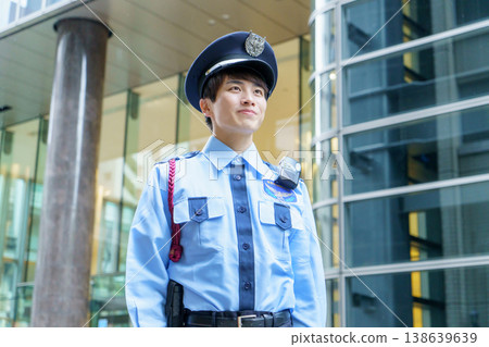 Young Japanese male security guard. Filming... - Stock Photo [138639639 ...