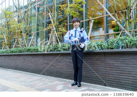 Young Japanese male security guard. Filming assistance provided by: Denpa Gakuen Educational Foundation, Tokyo Electronics College. Young Japanese male security guard. Filming assistance provided by: Denpa Gakuen Educational Foundation, Tokyo Electronics College. 138639640