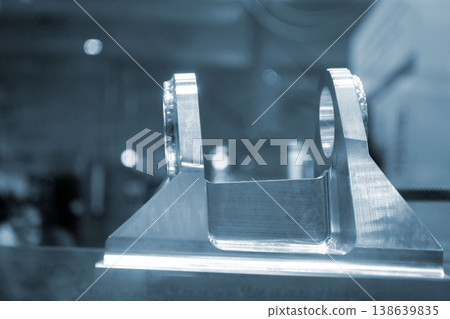 Metal part manufactured using CNC machining. Part made by metalworking CNC machine from metal. Polished aluminum or stainless steel. High-precision milling followed by polishing. Production technology 138639835