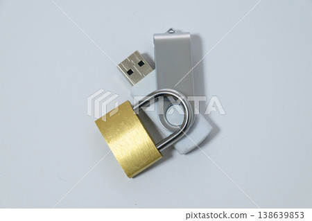 Data encryption represented by a USB memory stick and a padlock. 138639853