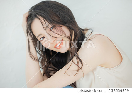 Young woman with long hair Young woman with long hair 138639859