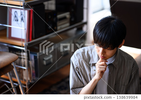 Close-up of a young man deep in thought 138639984