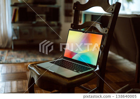 A laptop placed on a chair 138640005