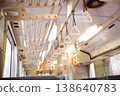 An empty local train car: a retro and nostalgic scene with rows of box seats and handrails. 138640783