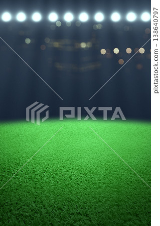 Vertical view of an empty green grass field in a sports stadium at night, illuminated by bright floodlights with a dark bokeh background, ready for a football or soccer match Vertical view of an empty green grass field in a sports stadium at night, illuminated by bright floodlights with a dark bokeh background, ready for a football or soccer match 138640797