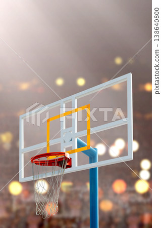 Close-up of a basketball hoop and backboard against a blurred background of stadium lights, capturing the atmosphere of a professional game Close-up of a basketball hoop and backboard against a blurred background of stadium lights, capturing the atmosphere of a professional game 138640800