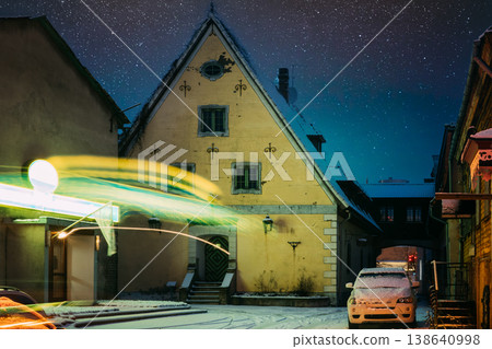 Historic yellow building with street light trails in Parnu Old Town during a snowy winter night Historic yellow building with street light trails in Parnu Old Town during a snowy winter night 138640998