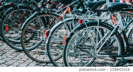 Parked Bicycles on a Cobblestone Street in Helsinki Parked Bicycles on a Cobblestone Street in Helsinki 138641016