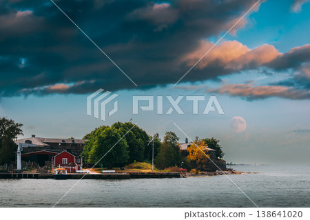 Suomenlinna Sea Fortress Under a Dramatic Cloudy Sky with a Full Moon Suomenlinna Sea Fortress Under a Dramatic Cloudy Sky with a Full Moon 138641020