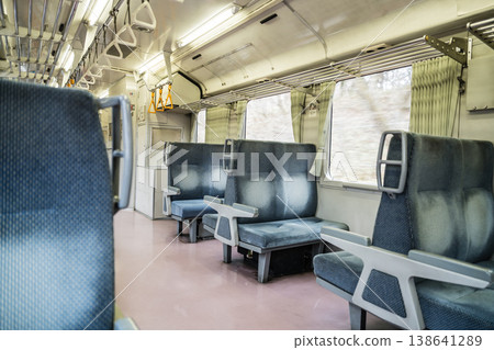 An empty local train car: Retro blue box seats and a nostalgic train journey (4K) An empty local train car: Retro blue box seats and a nostalgic train journey (4K) 138641289