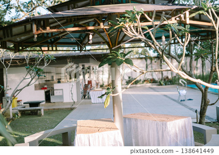 Poolside Canopy Bed with Seating Area in Resort Environment Poolside Canopy Bed with Seating Area in Resort Environment 138641449