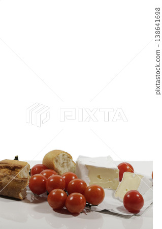 Still life with sprigs of cherry tomatoes. Still life with sprigs of cherry tomatoes. 138641698