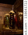 Herbal remedies made by medicine men using jars filled with snakes and other organic materials 138641722