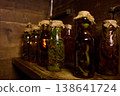 Herbal remedies made by medicine men using jars filled with snakes and other organic materials 138641724