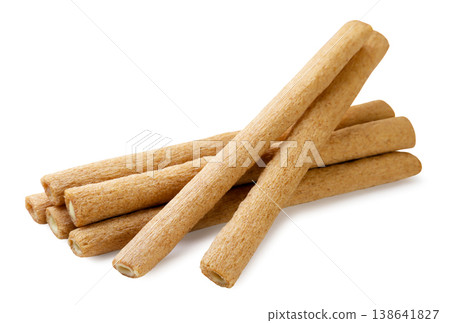 Pile of wafer sticks close-up on a white background. Isolated Pile of wafer sticks close-up on a white background. Isolated 138641827