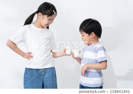 Boys and girls drinking milk Boys and girls drinking milk 138641842
