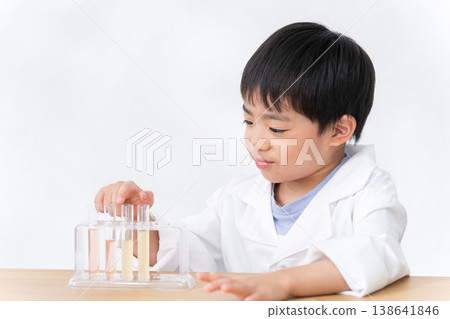 Children conducting science experiments using test tubes Children conducting science experiments using test tubes 138641846