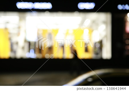 A yellow-colored nighttime window display. A yellow-colored nighttime window display. 138641944