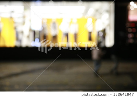 A yellow-colored nighttime window display. A yellow-colored nighttime window display. 138641947