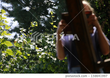 A girl in a blue t-shirt in nature. A girl in a blue t-shirt in nature. 138641997