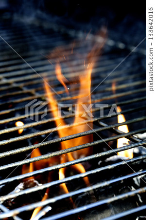 Outside BBQ Grill With Bright Flames And Glowing Coals ready for cooking on Outside BBQ Grill With Bright Flames And Glowing Coals ready for cooking on 138642016