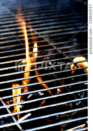 Outside BBQ Grill With Bright Flames And Glowing Coals ready for cooking on Outside BBQ Grill With Bright Flames And Glowing Coals ready for cooking on 138642017