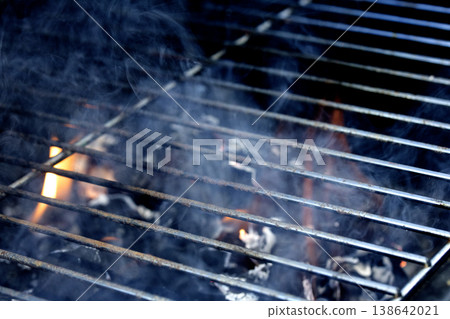 Outside BBQ Grill With Bright Flames And Glowing Coals ready for cooking on Outside BBQ Grill With Bright Flames And Glowing Coals ready for cooking on 138642021