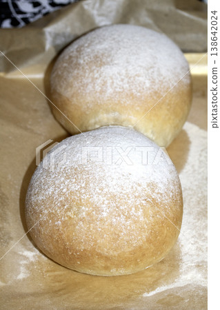 Home made bread roll baps freshly cooked with flour sprinkled on top Home made bread roll baps freshly cooked with flour sprinkled on top 138642024