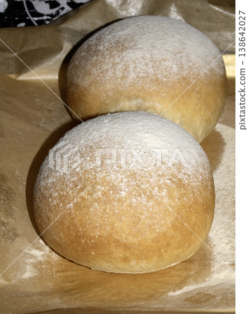 Home made bread roll baps freshly cooked with flour sprinkled on top Home made bread roll baps freshly cooked with flour sprinkled on top 138642027