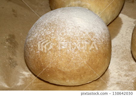 Home made bread roll baps freshly cooked with flour sprinkled on top Home made bread roll baps freshly cooked with flour sprinkled on top 138642030