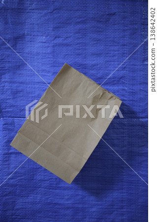 Kraft packaging on a polyester background. Kraft packaging on a polyester background. 138642402
