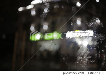 Close-up of raindrops on a window pane. 138642419