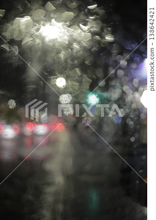 Close-up of raindrops on a window pane. Close-up of raindrops on a window pane. 138642421