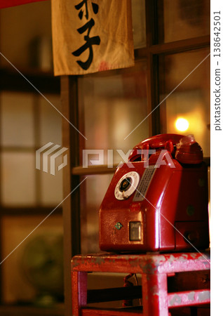 Retro red public telephone | Showa-era style, Japanese-style room, nostalgic atmosphere, dim lighting Retro red public telephone | Showa-era style, Japanese-style room, nostalgic atmosphere, dim lighting 138642501