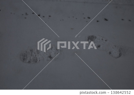 Human footprints on the snow. Human footprints on the snow. 138642552