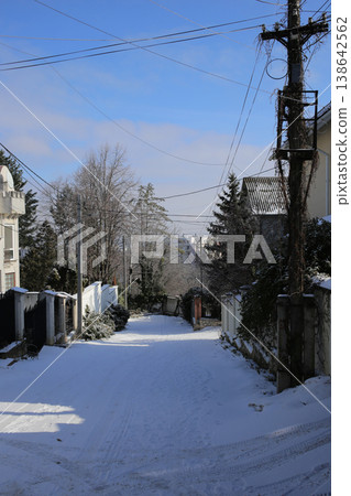 The alley is covered with fresh snow. Sunny day. The alley is covered with fresh snow. Sunny day. 138642562